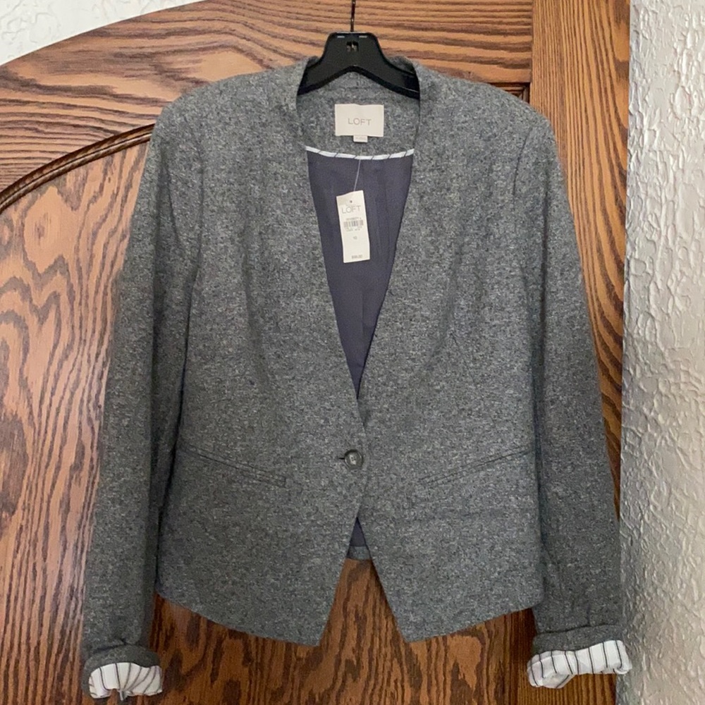 Brand new with tags grey blazer. Stretch material. Great fit!